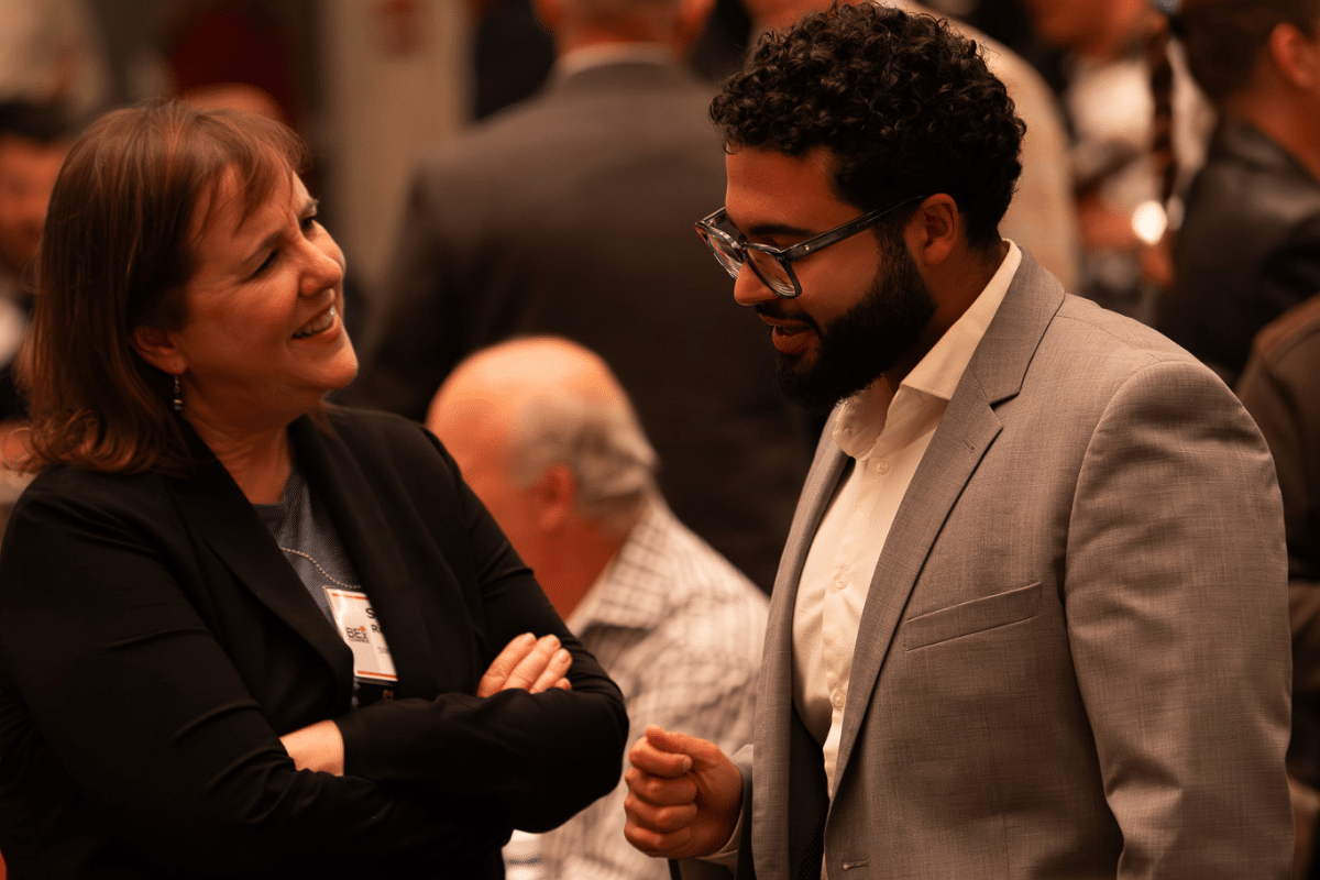 Connex attendees engaged in conversation during the event
