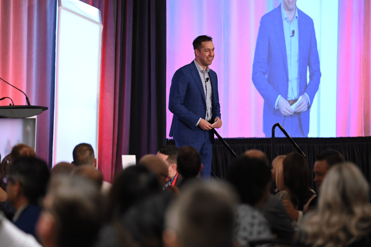 Jeff Tetz opening Connex on stage in front of the full room